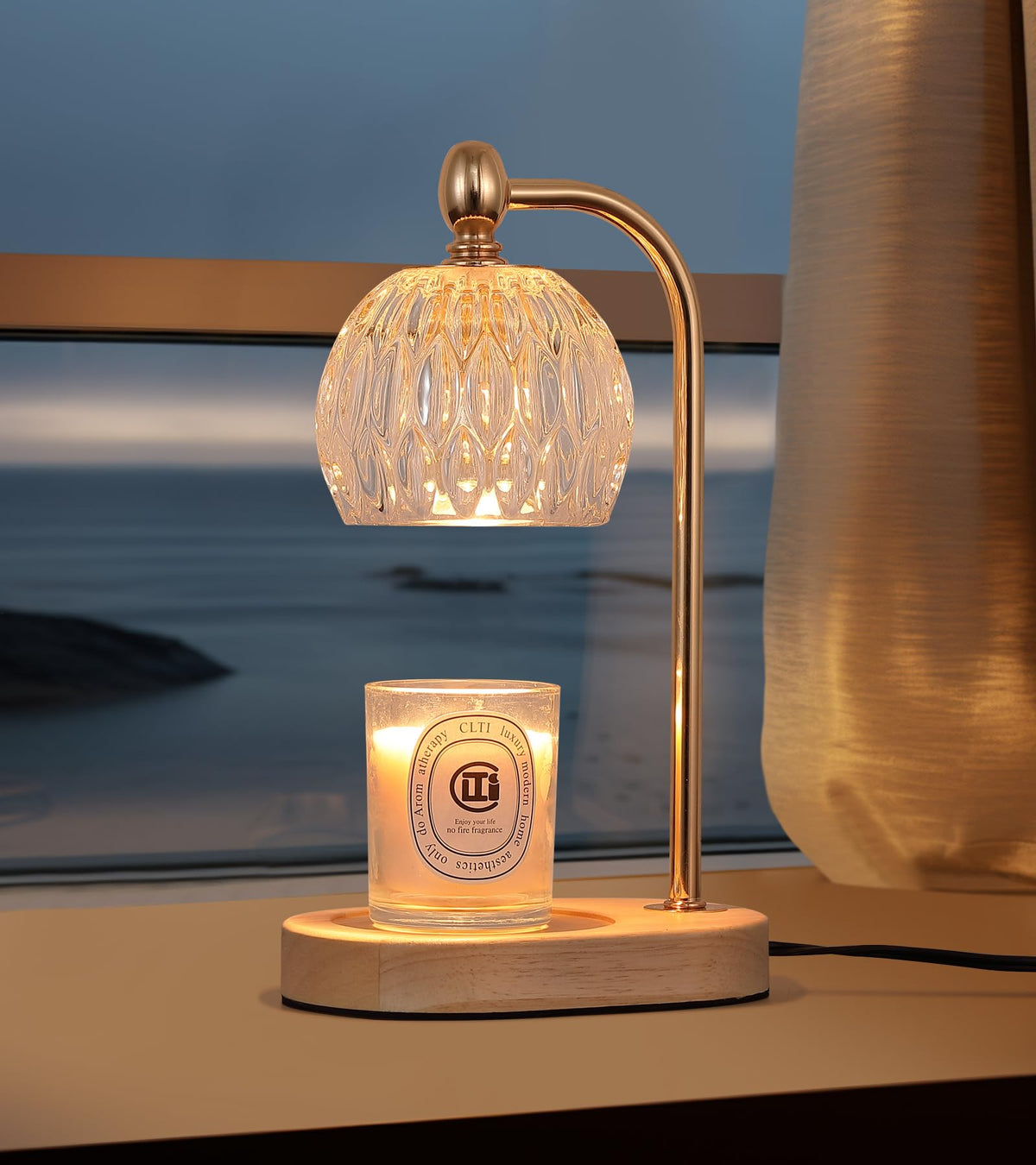 Elegant candle warmer lamp with timer and dimmer, illuminating a scented candle by the window.